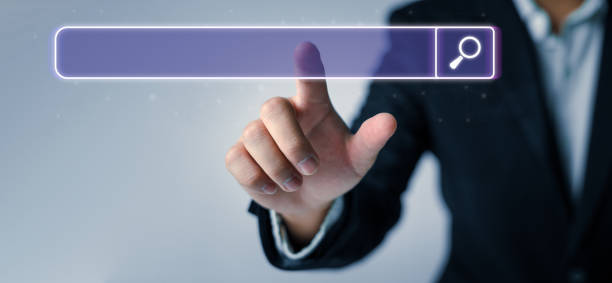 istock Man standing with hands pointing to information search is a data clicking to virtual internet search page computer touch screen. Education, Knowledge, Analysis the Internet to connect wirelessly. 1509045052