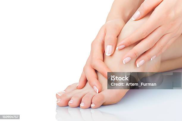 A Person Taking Care Of Their Feet Stock Photo - Download Image Now - Pedicure, Manicure, Nail Salon