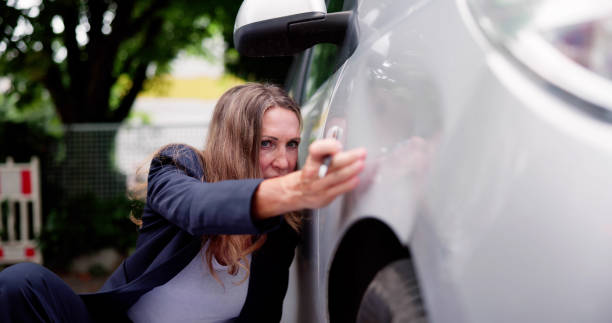 istock Insurance Agent Inspecting Damaged Car 1509056554