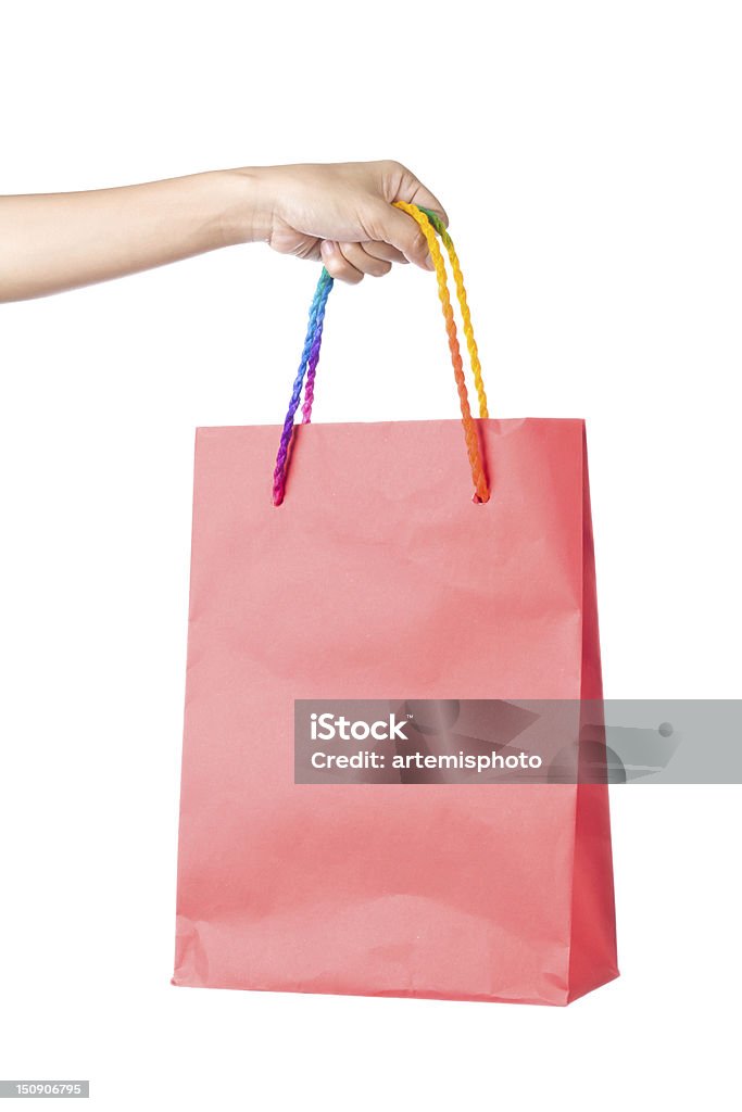 Shopping bag Lady hand holding red paper shopping  bag with  beautiful  color rope handle on white background Bag Stock Photo