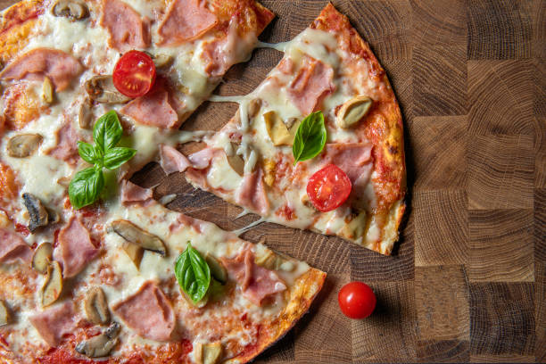 istock Delicious pizza served on a wooden board 1509074646