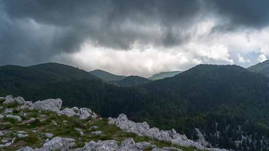 View of Velebit National Park under dramatic cloudsi n early summer.