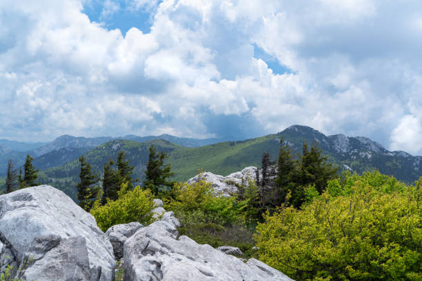 View of Velebit National Park under dramatic cloudsi n early summer.