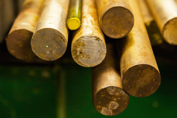 istock Large bronze round bars and steel threaded rods lie on a shelf, close-up. 1509088466