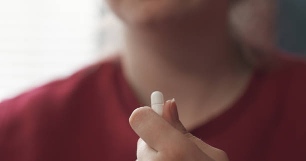 istock handheld teen girl taking pill 1509088539