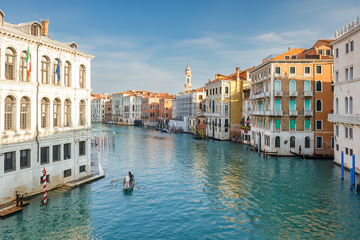 Venice, Italy - November 23, 2019: tourists on gondolas tour below the The Bridge of Sighs. Rio del Palazzo.