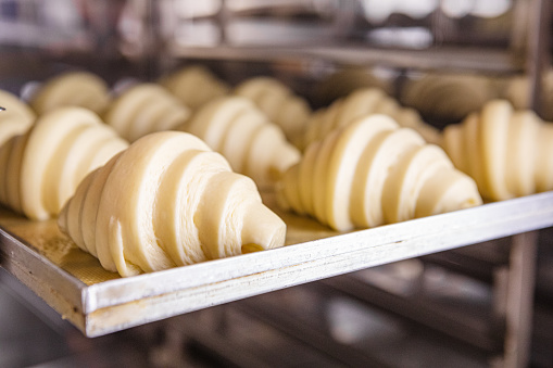 Bake proofed croissant dough on sheet