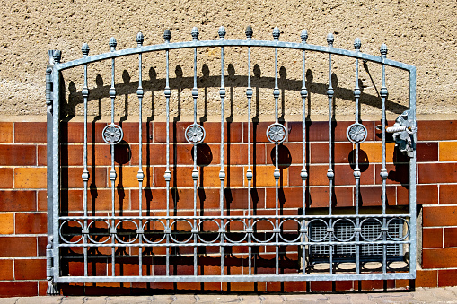 Metal wrought iron fence with decorative elements in Germany.