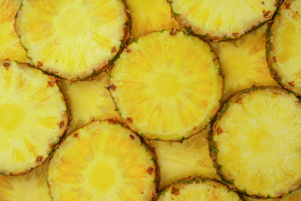 istock Pineapple juicy yellow slices as a background. 1509123605