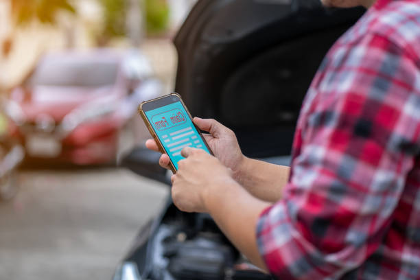 istock Young man using mobile phone to call insurance after car accident 1509134861
