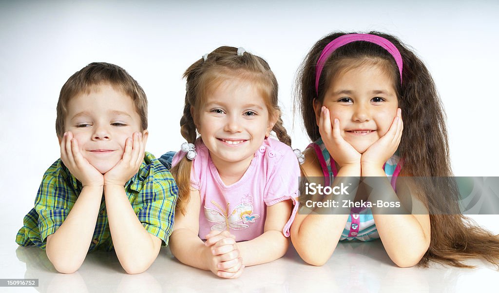 small kids laughing small kids on a white background Beautiful People Stock Photo