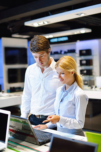istock couple in consumer electronics store buying laptop 150917177