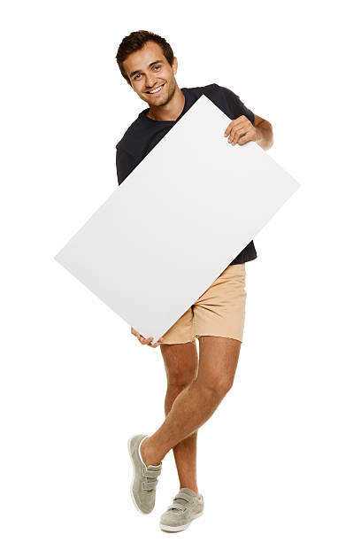 istock Man in summer clothing holding whiteboard 150917562