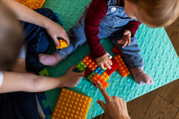 istock Baby playing whit her family at home 1509201426