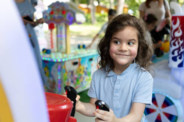 istock Little boy is having fun at at amusement park. He is playing amusement arcade. 1509240165