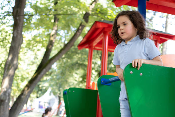 istock Happy little boy playing at the modern playground. 1509247827