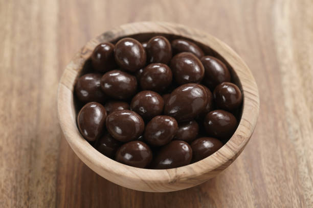 istock chocolate covered almonds in wood bowl on table 1509258527