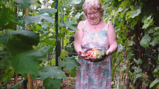 Proud woman showing off her home-grown produce