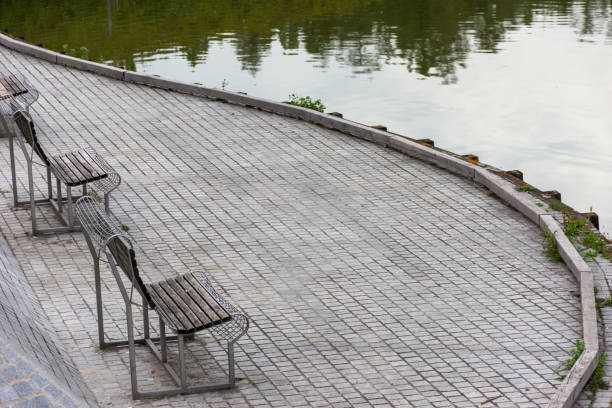istock Empty benches on the shore of a large lake 1509284326