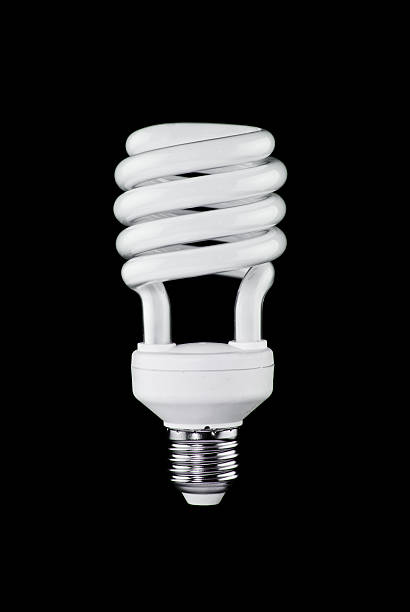 Energy saving lamp on black background stock photo