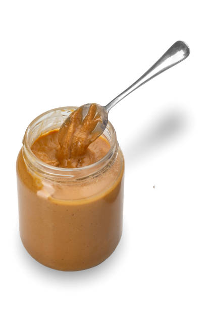 istock Peanut butter in an open glass jar 1509297321