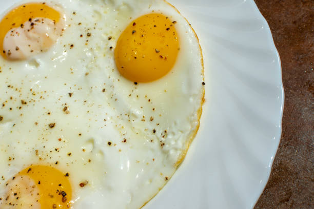 istock On a plate are three chicken eggs with salt and black pepper 1509302234