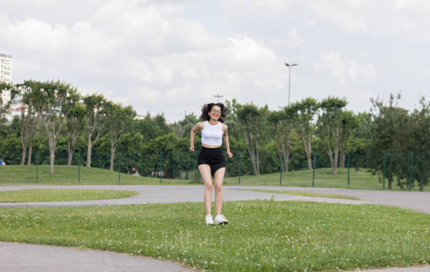 istock Young Turkish woman is jumping at public park. 1509302802