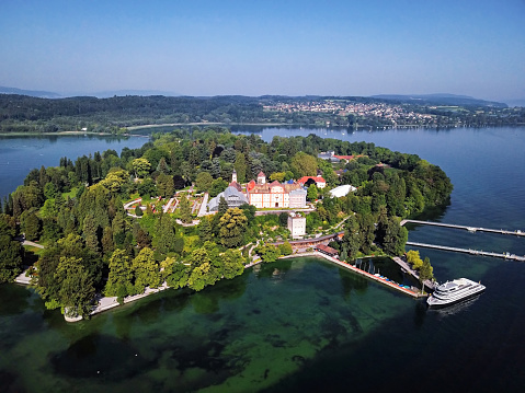 A beautiful view of the Lake Constance with Mainau Island in the background on a sunny day, Germany