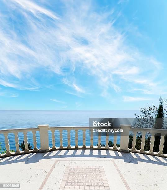 View To The Sea From A Balcony Under Cloudy Sky Stock Photo - Download Image Now - Architecture, Art, Art And Craft