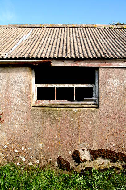 Old farm building - no glass in window stock photo