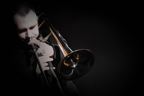 Trombone player. Trombonist playing jazz musician. Man playing trumpet brass instrument