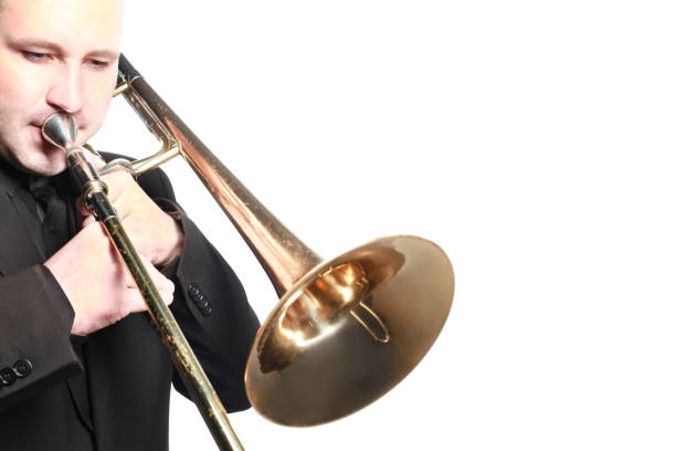 istock Trombone player. Trombonist playing jazz musician isolated on white 1509350500