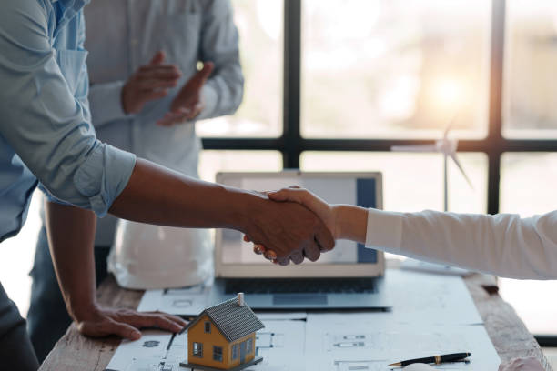 istock Architect and engineer work together and shaking hands to welcome home design projects to work in the same way and work together as a team. 1509360580