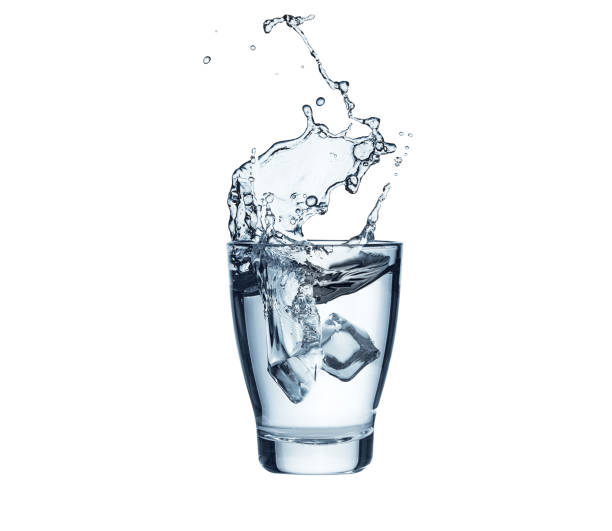 istock Ice cube splashes into glass of pure water 1509370828