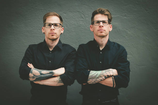 double trouble double trouble twin brothers concept. two men same clothes stock pictures, royalty-free photos & images