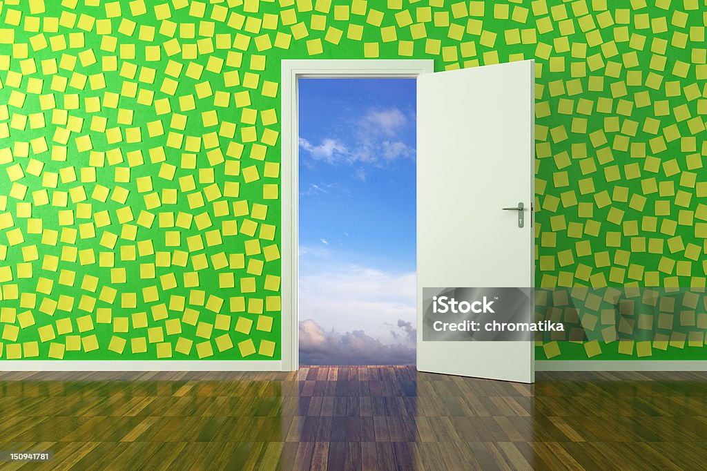 Green room full of post it notes with white door leading out Green room with a myriad of yellow post it on the wall, with sky, white door and parquet Accessibility Stock Photo