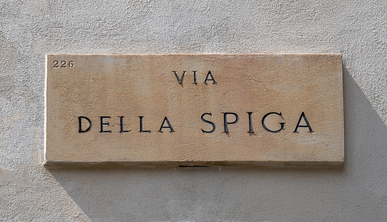 Marble sign of the famous Via della Spiga, one of the streets in the historic center of Milan that bounds the so-called \