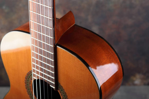 istock Mahogany classical guitar on vintage background. 1509449663
