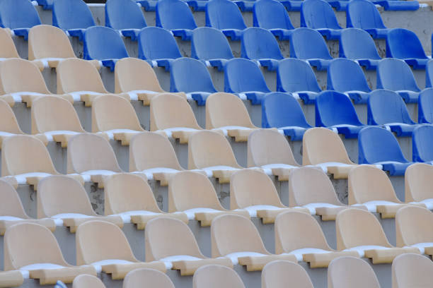istock Empty stadium seats in winter. Rows of chairs for seating in arena stadium. Sport pattern. 1509451811