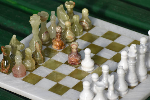 Pieces on a chess board. The white pawn moves to e4.