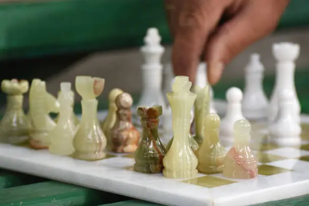 Street chess game. The grandmaster makes a pawn move. Tournament to International Chess Day.