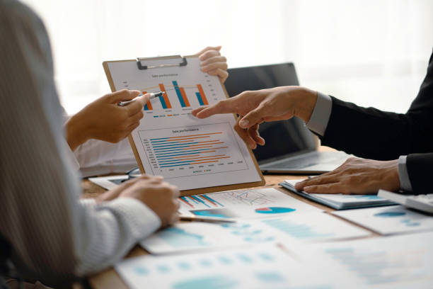 istock Close-up view of businessman analyzing graphs and organization chart explain to the meeting the future business trends in the organization. 1509469341