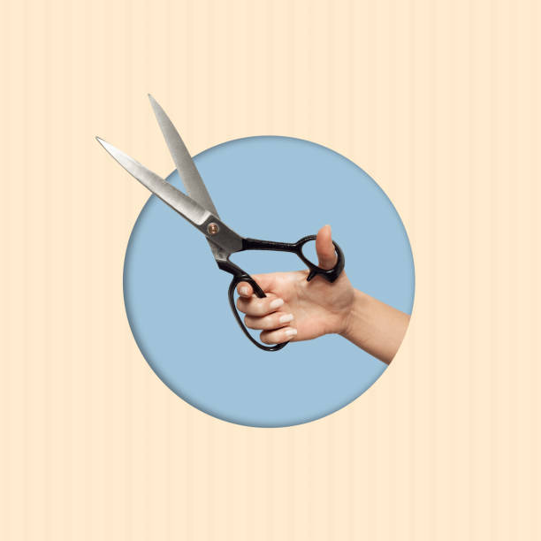 istock Contemporary art collage of a hand holding scissors. 1509476355