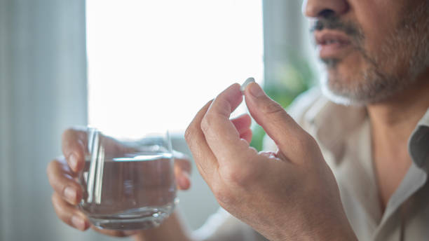 istock Adult man is using medicine at home 1509480116