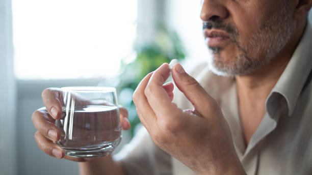 istock Adult man is using medicine at home 1509480120