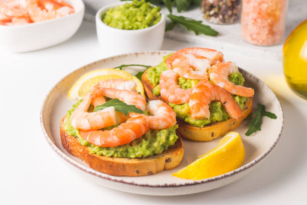 istock Shrimps on toast with avocado and lemon. Breakfast concept. Bruschetta. 1509483782