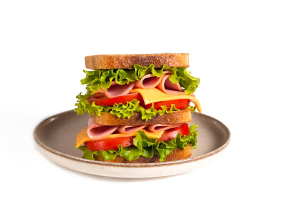 istock Club sandwich with ham, cheese, tomato and lettuce. 1509486497