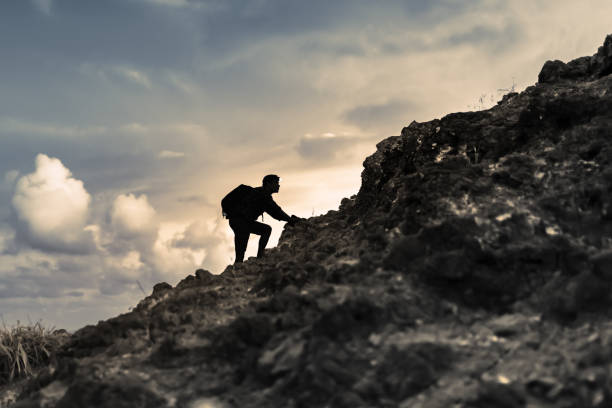 istock Man climbing Rocky Mountain. 1509513284