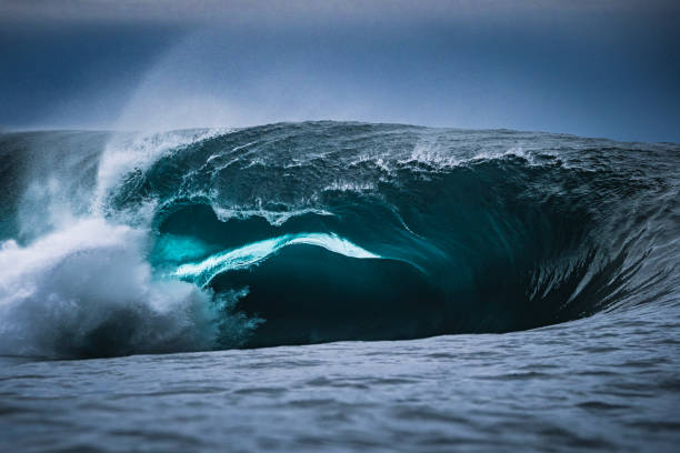 istock Powerful abstract ocean wave crashing over shallow reef with stormy sky 1509514908