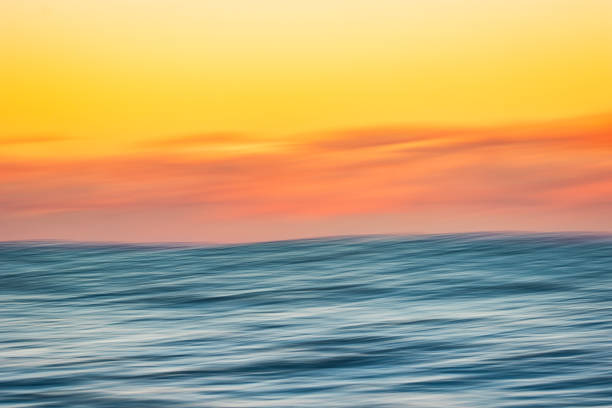 istock Abstract motion blur of smooth ocean in golden light 1509515959